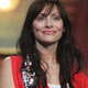 Australian singer Natalie Imbruglia presents an award at the Brit Awards in London.