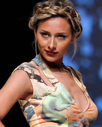 A model presents a creation by designer Nicole Miller during Cali Exposhow