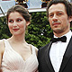 French actress Laetitia Casta (L) and her companion, Italian actor Stefano Accorsi arrive on the red carpet for the screening of the film 'La Conquete' at the 64th Cannes Film Festival