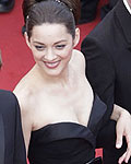 Director Audiard (R) arrives on the red carpet with cast members Matthias Schoenaerts (L), Armand Verdure (2ndL) and Marion Cotillard for the screening of the film 'De rouille et d'os', in competition at the 65th Cannes Film Festival