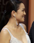 Best Actor award winner Mads Mikkelsen for the film 'Jagten' (The Hunt) reacts next to actress Gong-Li during the awards ceremony of the 65th Cannes Film Festival