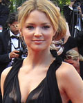 Actress Virginie Efira poses during red carpet arrivals for the film 'Mud', in competition at the 65th Cannes Film Festival