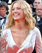 Model Petra Nemcova poses on the red carpet as she arrives for the screening of the film 'Behind the Candelabra' in competition during the 66th Cannes Film Festival