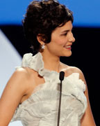 Jury President Steven Spielberg delivers a speech next to Mistress of Ceremony actress Audrey Tautou during the opening ceremony of the 66th Cannes Film Festival in Cannes