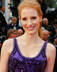 Actress Jessica Chastain poses on the red carpet as she arrives for the screening of the film 'All is Lost' during the 66th Cannes Film Festival