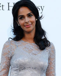 Actress Malika Sherawat arrives for amfAR's Cinema Against AIDS 2013 event in Antibes during the 66th Cannes Film Festival