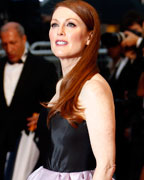 Actress Julianne Moore poses on the red carpet as she arrives for the screening of the film 'The Great Gatsby' and for the opening ceremony of the 66th Cannes Film Festival in Cannes