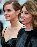 Director Sofia Coppola and Emma Watson and Taissa Farmiga, cast members of the film 'The Bling Ring', pose on the red carpet as they arrive for the screening of the film 'Jeune