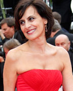 French fashion designer and former model Ines de la Fressange poses on the red carpet as she arrives for the screening of the film 'Jeune