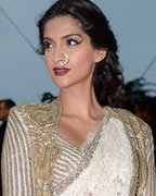 Sonam Kapoor poses on the red carpet as she arrives for the screening of the film 'The Great Gatsby' and for the opening ceremony of the 66th Cannes Film Festival