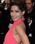 Freida Pinto poses on the red carpet as she arrives for the screening of the film 'The Great Gatsby'' and for the opening ceremony of the 66th Cannes Film Festival