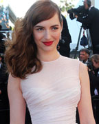 Actress Louise Bourgoin poses on the red carpet as she arrives for the screening of the film 'Le Passe' (The Past) in competition during the 66th Cannes Film Festival