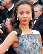 Cast member Zoe Saldana poses on the red carpet as she arrives for the screening of the film 'Blood Ties' during the 66th Cannes Film Festival in Cannes