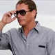 Actor Jean-Claude Van Damme arrives for a photocall on the beach front during the 61st Cannes Film Festival