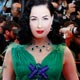 U.S. burlesque artiste Dita Von Teese arrives on the red carpet before the screening of The Exchange by U.S. director Clint Eastwood