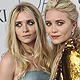 Ashley and Mary-Kate Olsen pose on the red carpet at the CFDA Fashion awards at the Lincoln Center's Alice Tully Hall in New York City