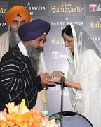 Balwinder Singh Jaurasingha, Addl. Secy SGPC being presented a Shal by Producer Pammi Baweja