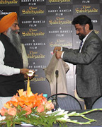 Paramjeet Singh Khalsa being presented Shawl by Harry Baweja