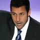 Actor Adam Sandler holds up his award for Favorite Funny Male Star at the 35th annual People`s Choice awards in Los Angeles