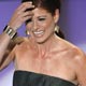 Actress Debra Messing presents award at the 35th annual People`s Choice awards in Los Angeles