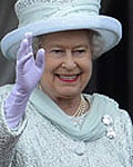 Britain's Queen Elizabeth waves as she stands with Prince Charles (L) and Prince William on the balcony of Buckingham Palace in London