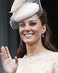 Britains Catherine, Duchess of Cambridge waves from the balcony of Buckingham Palace as Prince William (L) and Prince Harry (R) look on during the Queens Diamond Jubilee in central London