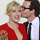 Winslet gets kiss from co-star Guy Pearce at the 63rd Primetime Emmy Awards in Los Angeles