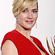 Kate Winslet holds her award at the 63rd Primetime Emmy Awards in Los Angeles