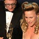 Arquette accepts award from James Spader during Prime Time Emmy Awards in Los Angeles.