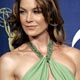 Presenter Ellen Pompeo poses backstage at 57th Emmy Awards in Los Angeles.