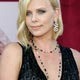 Charlize Theron poses at the 57th annual Prime Time Emmy Awards in Los Angeles.