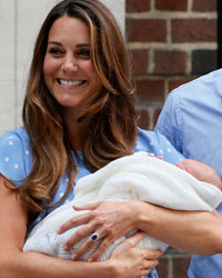 Britain's Prince William and his wife Catherine, Duchess of Cambridge appear with their baby son outside the Lindo Wing of St Mary's Hospital, in central London