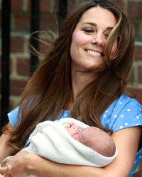 Britain's Catherine, Duchess of Cambridge, wife of Prince William, appears with her baby son outside the Lindo Wing of St Mary's Hospital, in central London