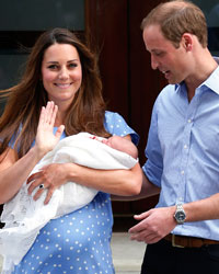 Britain's Prince William and his wife Catherine, Duchess of Cambridge appear with their baby son, outside the Lindo Wing of St Mary's Hospital, in central London