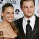 Actors Hilary Swank and Leonardo DiCaprio pose with their awards, won for best actress and actor in a leading role-drama