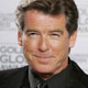 Actor Pierce Brosnan poses for photographers after presenting at the 62nd annual Golden Globe Awards