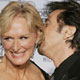 Actress Glen Close gets a kiss from Al Pacino after winning her award for best actress in a leading role - mini series or television movie, for her role in 'The Lion In Winter'