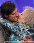 Actors Alex Pettyfer and Betty White kiss during the 24th Annual GLAAD Media Awards at JW Marriott Los Angeles at L.A. LIVE in Los Angeles, California