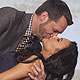 Actress Naya Rivera is kissed by a man who made the highest bid to kiss her at the 23rd annual GLAADMedia Awards in New York