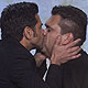 Actor John Stamos (L) kisses the man who bid highest to kiss him in an auction at the 23rd annual GLAAD Media Awards in New York