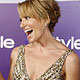 Toni Collette holds her award as she arrives at the Warner Bros./InStyle after party in Beverly Hills