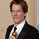 Kevin Bacon poses with his award at the 67th annual Golden Globe Awards in Beverly Hills