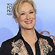 Meryl Streep poses with her award for best performance by an actress in a motion picture - drama for 'The Iron Lady'