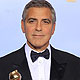 George Clooney poses with his award for best actor in a motion picure - drama for 'The Descendants'