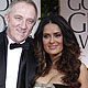 Salma Hayek and husband Francois-Henri Pinault pose on the red carpet at the 69th annual Golden Globe Awards in Beverly Hills