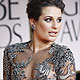 Lea Michele poses as she arrives at the 69th annual Golden Globe Awards