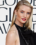 Model Rosie Huntington-Whiteley and actor Jason Statham arrive at the 70th annual Golden Globe Awards in Beverly Hills