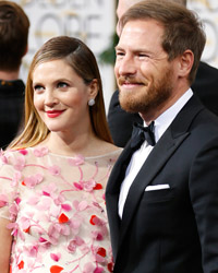 Actress Drew Barrymore and husband, Will Kopelman, arrive at the 71st annual Golden Globe Awards in Beverly Hills, California