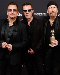 Bono, Adam Clayton, The Edge and Larry Mullen, Jr. from the band U2 pose with their award for Best Original Song for 'Ordinary Love' from the film 'Mandela: Long Walk to Freedom' at The Weinstein Company