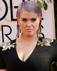 TV personailty Kelly Osbourne poses as she arrives at the 71st annual Golden Globe Awards in Beverly Hills, California